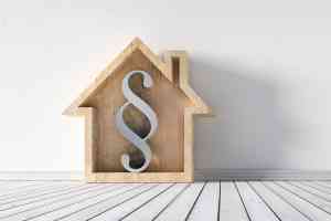 Häuschen mit Paragraf-Zeichen darin